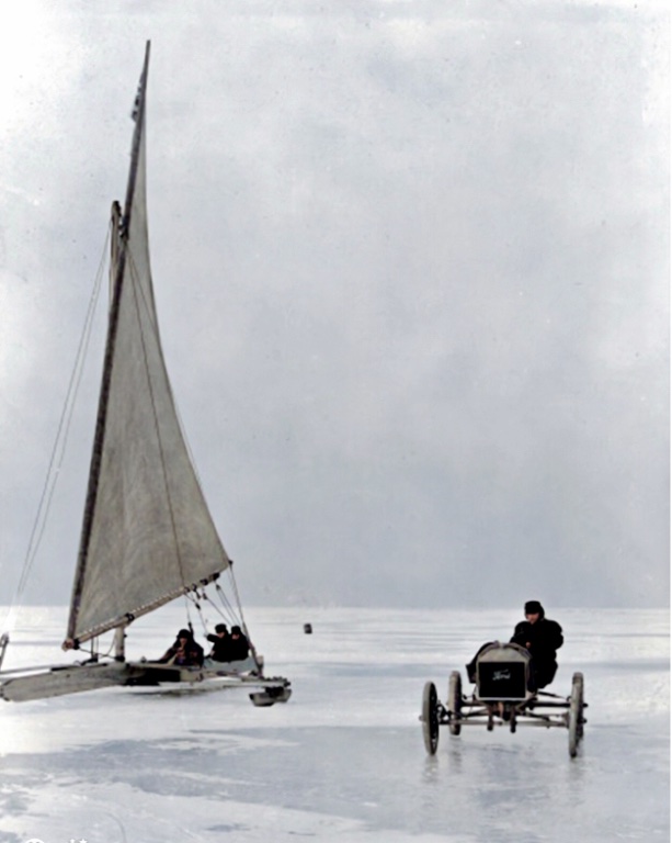 The competing vehicles (one with triangular sail) seen side-by-side on the frozen Lake St. Claire.