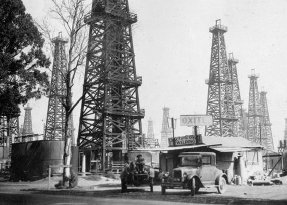 Circa 1920 photo of Los Angeles derricks and gas station  courtesy Library of Congress.