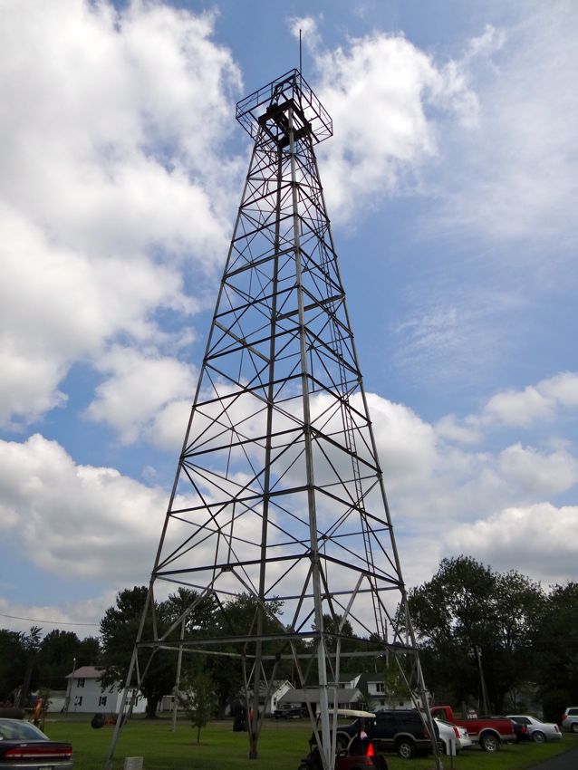 Illinois-museum-derrick-AOGHS A steel derrick with its crown is preserved as clouds frame it in the Illinois sky.