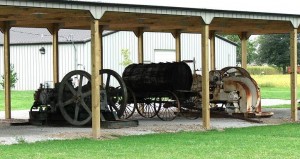 Illinois-museum-outdoor-AOGHS Oilfield engines and equipment outside the Illinois Oil Field Museum.