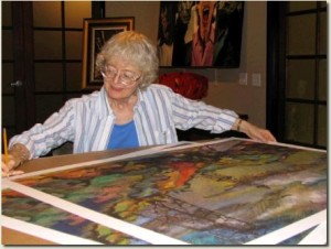 JoAnn-Cowans-website-AOGHS JoAnn Cowans inspects one of her large prints.