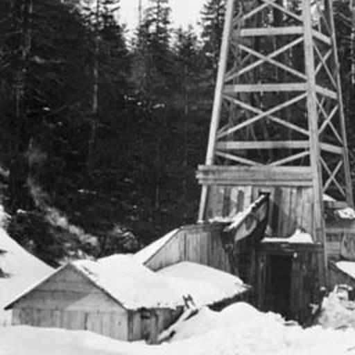 Katalla oilfield in Alaska oil well and a snow covered cable-tool derrick.