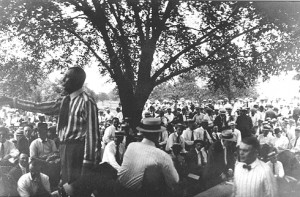March-2-elm-AOGHS Circa 1920s photo of E.E. Walters auctioning Osage leases in shade of Elm tree