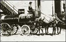 Late 19th-century photo of Continental Oil tank wagon, driver and horses.