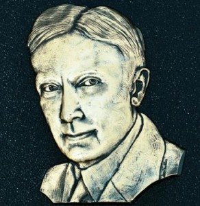 Relief portrait in polished metal of wildcatter Tom Slick.