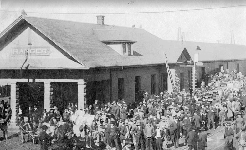 Exterior view of a very crowded train station during the Ranger drilling boom.