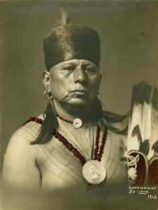 Chief Bacon Rind, Osage friend of the million dollar auctioneer, with a round medallion.