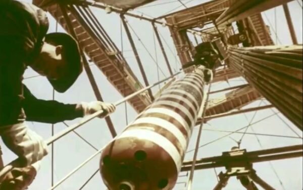 Worker with rope lowers a nuke into a USSR well in 1966. Slowly.