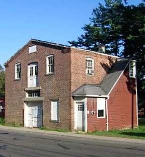 Exterior of red-brick barn and once Standard Oil kerosene warehouse now demolished.